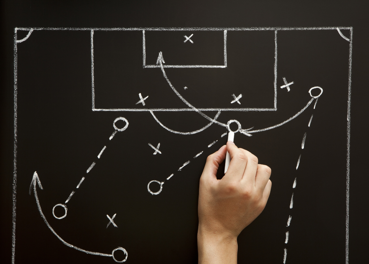 Blackboard drawing of a football pitch with tactical instructions representing a data strategy
