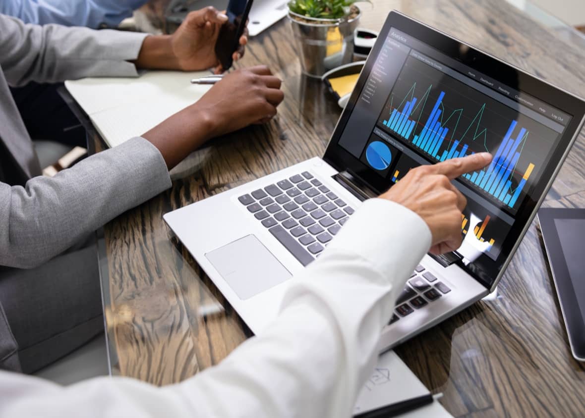 Person looking at valuable business data sources on a laptop