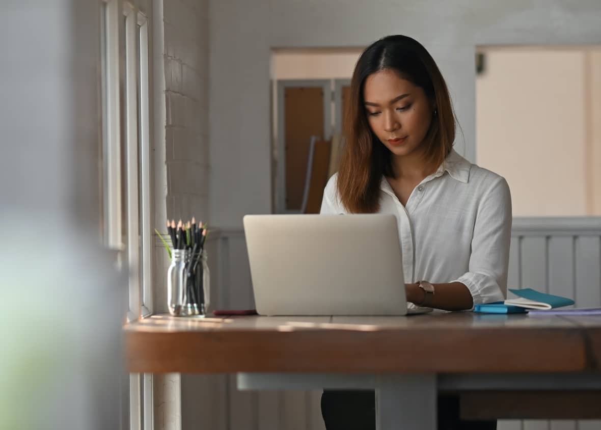 Woman working from her home office due to COVID-19